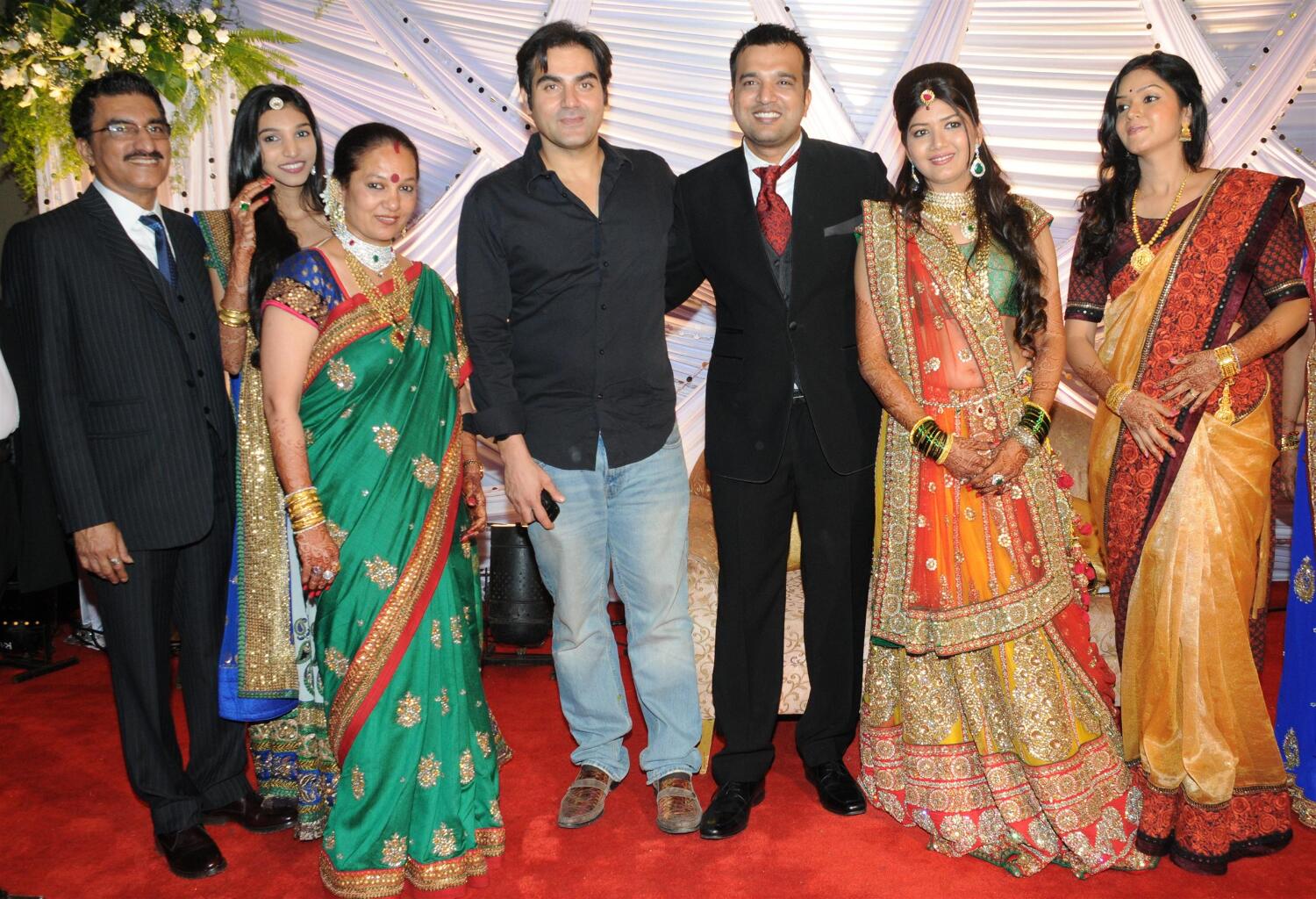 Arbaaz Khan posing with the newly weds at wedding reception of Suraj