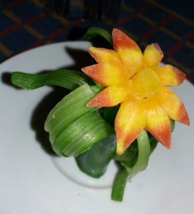 Flower is made from a small piece of carrot nd spring onion